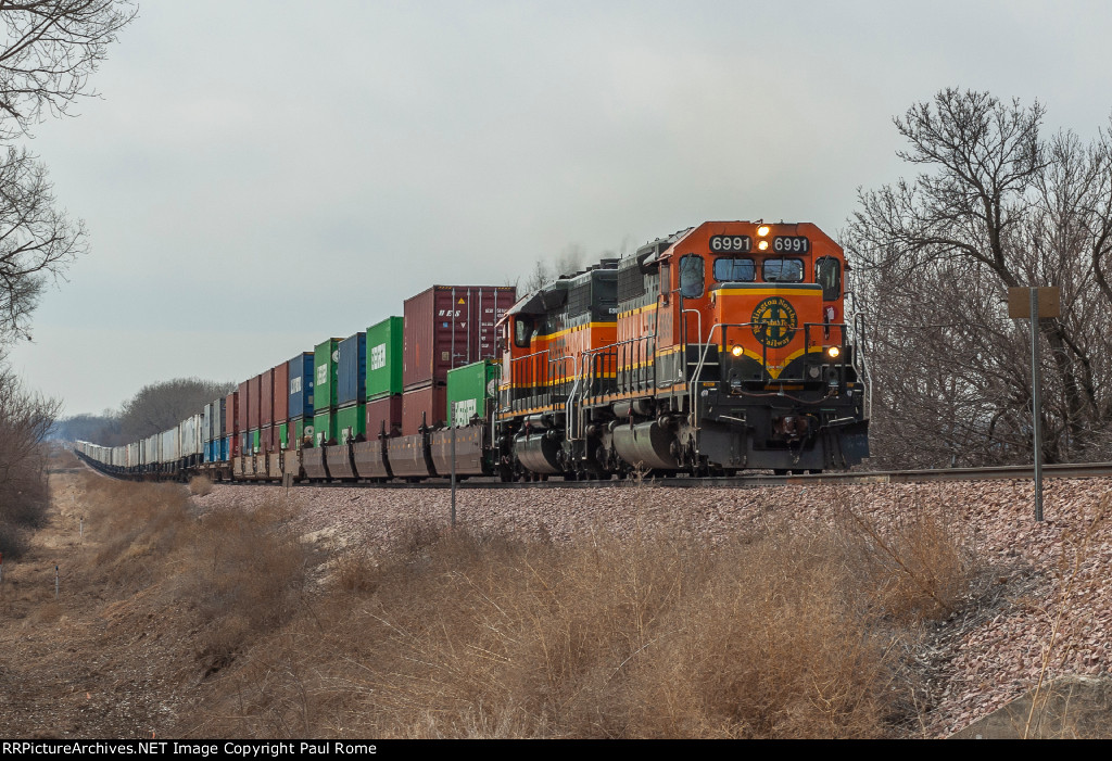 BNSF 6991, ex CN 5054, and BNSF 6984 ex CN 5016 are eastbound on the BNSF CN 5016 